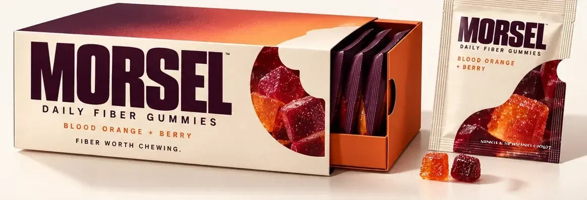Morsel box slid open beside a single-serve pouch and orange and berry fiber gummies
